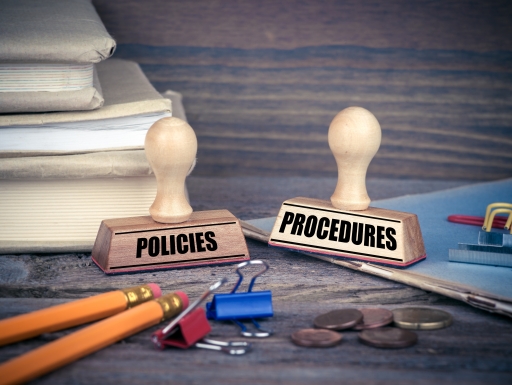 Policies and Procedures concept. Rubber Stamp on desk in the Office. Business and work background.