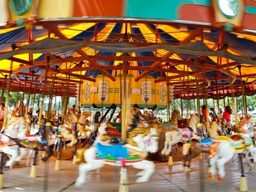 Carousel with brightly decorated horses.