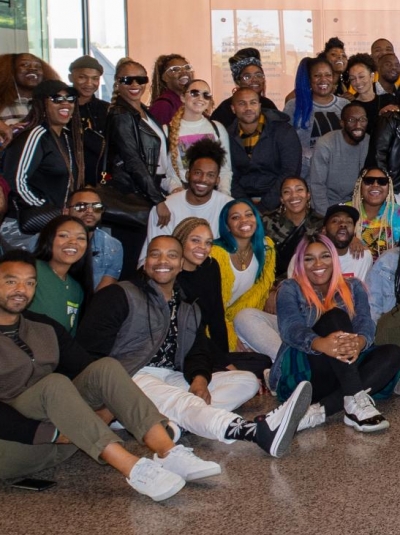 National Museum of African American History and Culture visitors smile for a group photo