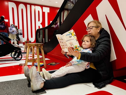 older woman reading to a child