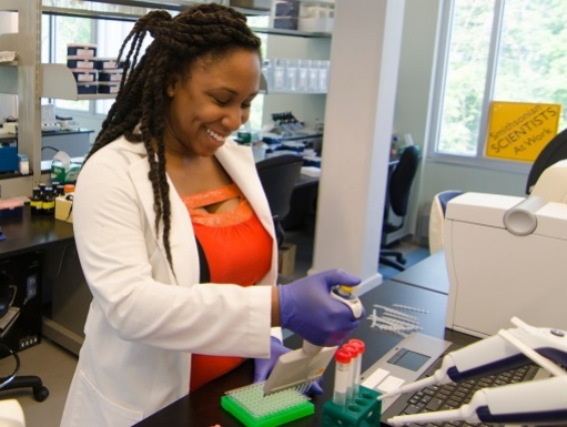 A scientist uses a pipette. 